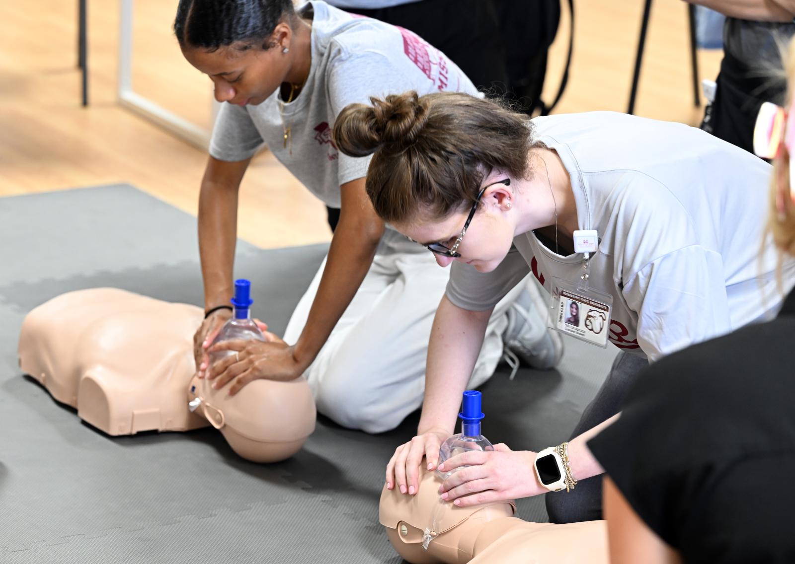 Students practicing CPR