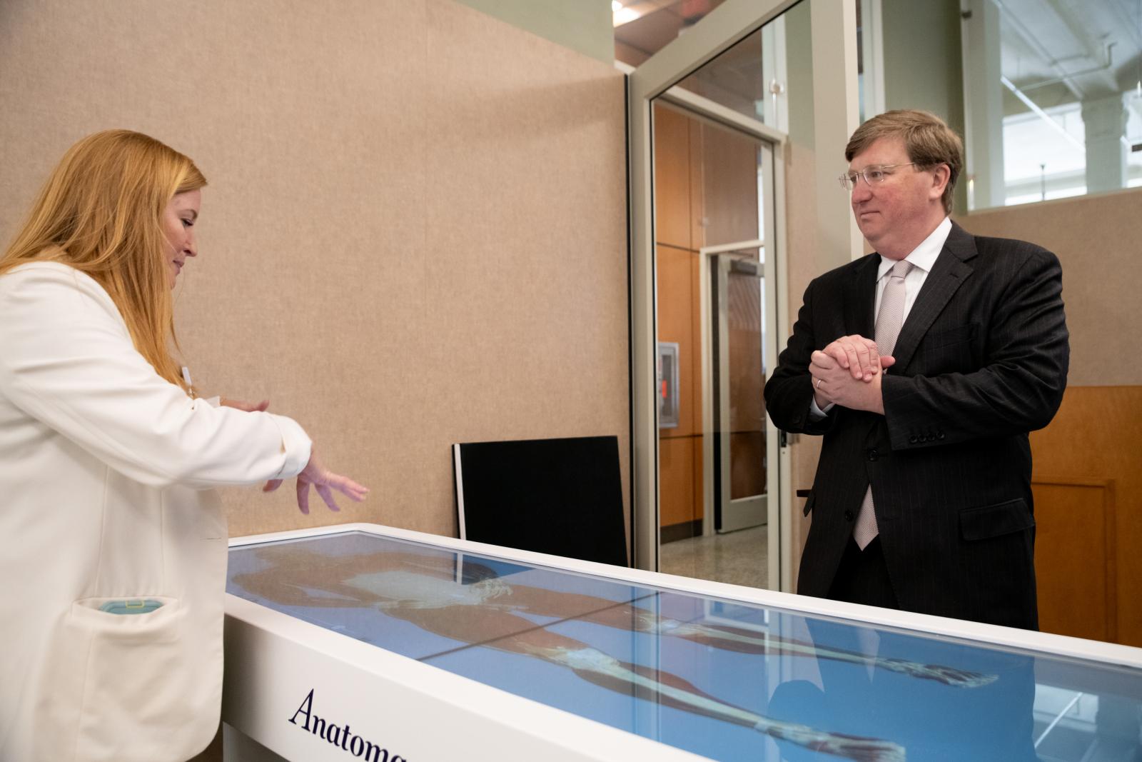 MSU Director of Physician Assistant Studies Shey Washburn demonstrates healthcare education technology to Gov. Tate Reeves during his tour of the Interprofessional Simulation Program at MSU-Meridian. MSU Director of Physician Assistant Studies Shey Washburn demonstrates healthcare education technology to Gov. Tate Reeves
