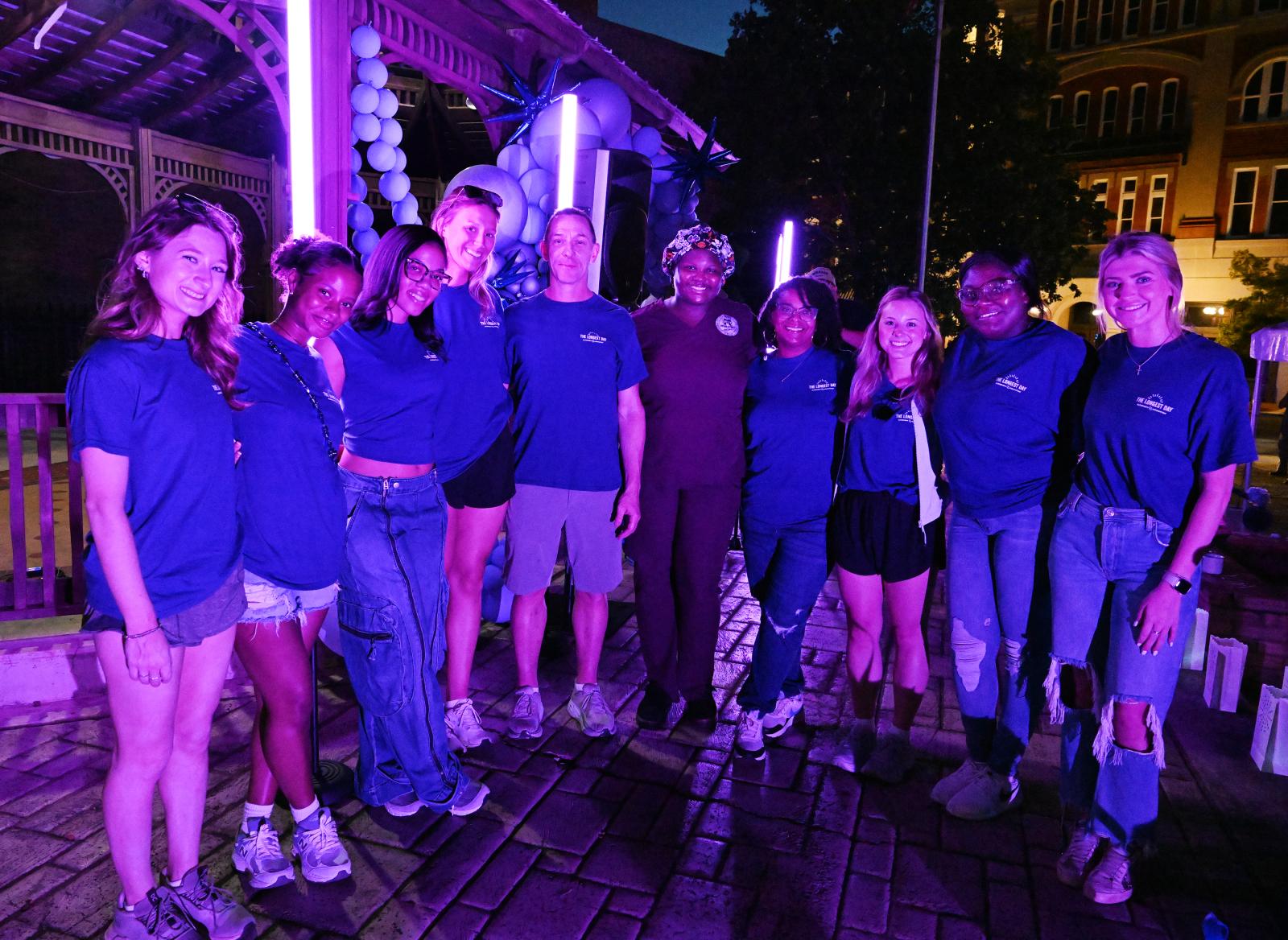MSU-Meridian Master of Science in Nursing students pose for a photo in Dumont Plaza after volunteering at the Paint the Plaza Purple community event to raise awareness of Alzheimer’s. Pictured are Amy Deem, Jada Bantom, Jana Ewing, Addie Stubbs, event organizer Dan Donnelly, Mykala Stevenson, Katrina Olive, Anna Rose Harris, Ta&#039;Lynda Boyd and Olivia Adams.