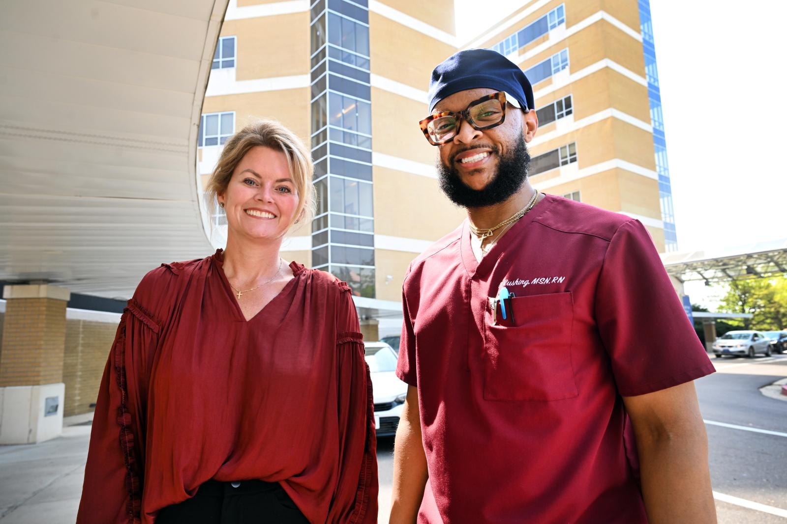 MSU PHOTO ID: From left, University of Mississippi Medical Center Registered Nurse Dekendrick Rushing and Mississippi State University-Meridian Assistant Professor of Healthcare Administration Mary Smith stand outside of UMMC, where Rushing cared for Smith’s mother three months after graduating from MSU-Meridian’s Master of Science in Nursing program. (Photo by Marianne Todd)