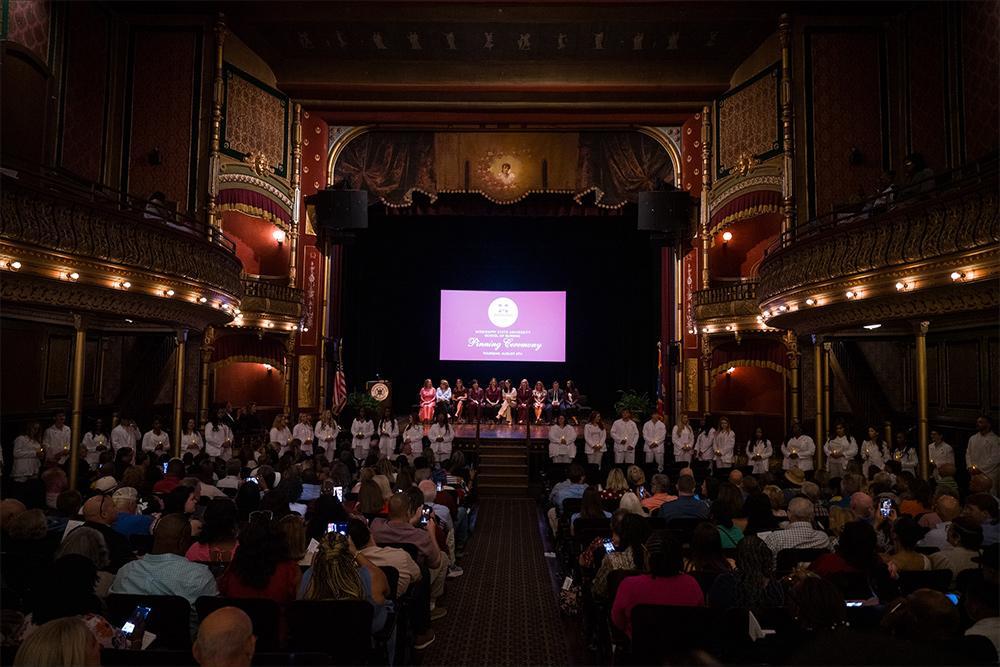 Prior to receiving their degrees, the 35 students were ceremoniously pinned in a rite of passage, affirming each nurse’s place within the community and their promise to uphold the values of the profession. (Photo by Grace Cockrell)